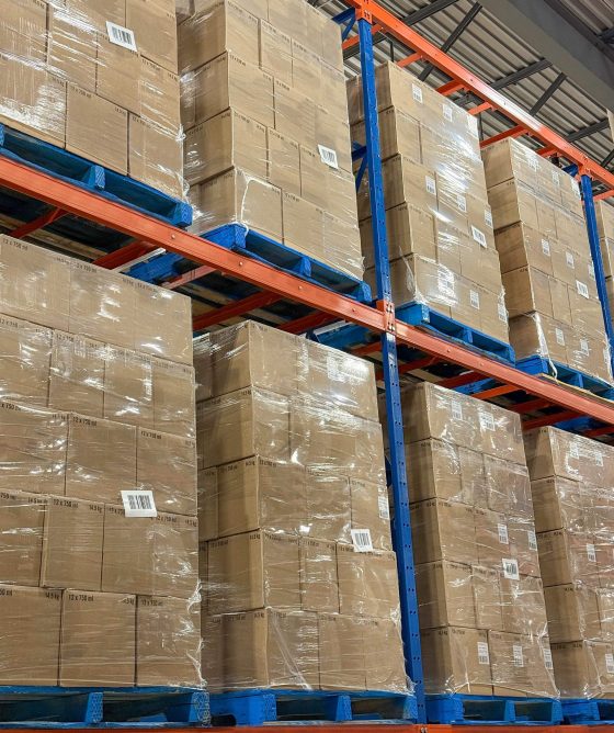 Pallets of boxes of wine stacked in distribution centre ready for shipment. Pallets of boxes of wine stacked in distribution centre ready for shipment.